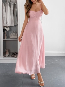Full length view of a pink pleated maxi dress with camisole straps and slim fit design