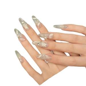 Handmade cat eye press-on nails with silver cat-eye finish, butterfly patterns, and pearls
