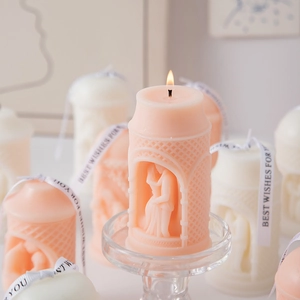 Detailed relief candle with couple sculpture carving and decorative Best Wishes ribbon