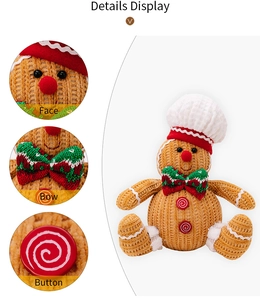 Detail display of ginger bread man doll showing embroidered face, bow, and button texture