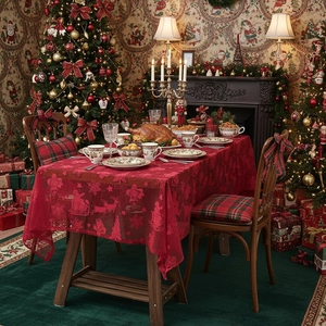 Red Christmas lace tablecloth featuring Santa and reindeer designs for festive home decor