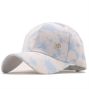 Blue and white tie-dye cotton baseball cap featuring a silver metallic M logo side detail