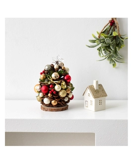 Mini pine cone Christmas tree tabletop decor with festive red, gold and silver ornaments