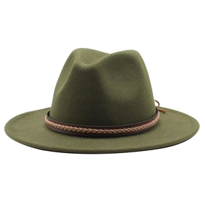 Close-up of olive green wool fedora hat featuring woven leather band and tassel detail