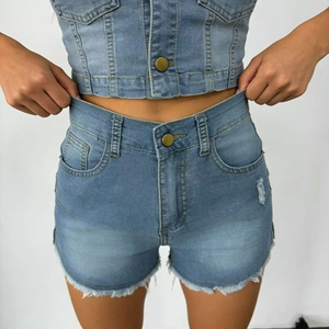 Close-up of light blue high-waisted denim shorts featuring frayed edges and stitch details