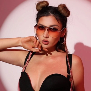 Fashion rimless pilot sunglasses with orange gradient lenses and a silver metal frame