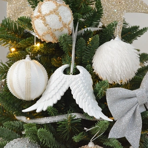 Sparkling white and silver Christmas tree ornaments with sequins and plush textures