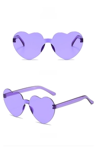 Detail view of purple heart-shaped rimless sunglasses from front and side angles