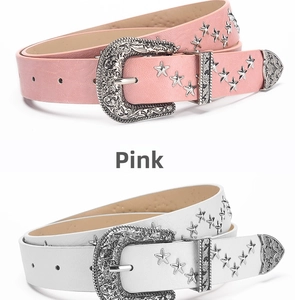 Detail of pink and white punk belts with star studs and western floral buckles