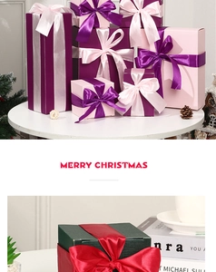Close-up of decorative Christmas gift boxes with silk ribbons and multi-color card paper