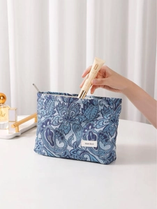 Blue paisley floral jacquard makeup bag for women with textured fabric and metal zipper