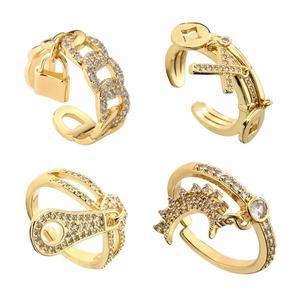 Set of four gold-plated cross and lock rings with zircon micro-pave in 2x2 grid view