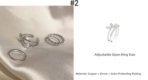 Detail view of silver butterfly ring set with cubic zirconia and woven band details