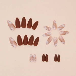 Matte almond press-on nails with dark brown finish and marble gold foil design