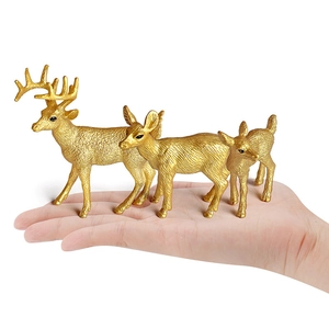 Golden forest deer miniature figurines set of three held in hand for scale