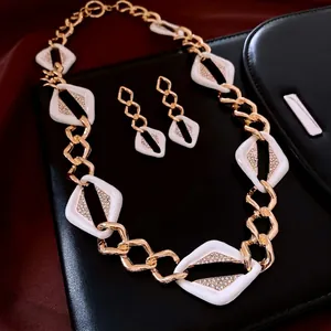 Art Deco geometric jewelry set with diamond earrings and chunky necklace on leather