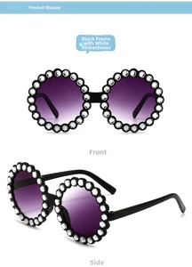 Detail of round children's sunglasses with black frame and crystal rhinestone trim