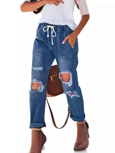 Women's blue distressed denim pants with elastic drawstring waist and knee-hole details