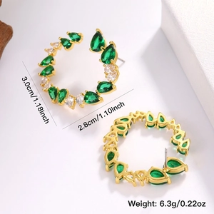 Golden C-shaped hoop earrings with green and white teardrop cubic zirconia stones
