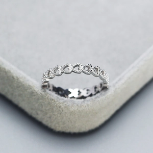 Minimalist 925 sterling silver open ring with hollow heart patterns on velvet box