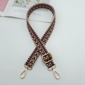 Adjustable crossbody bag strap with pink and green geometric patterns and gold metal hooks