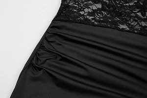 Detail of elegant black lace pattern and side ruched texture on a slim fit maxi dress