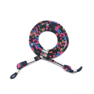 Ethnic bohemian braided eyewear strap with colorful patterns and adjustable loops