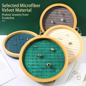 Round bamboo wood jewelry display tray with microfiber lining for ring storage