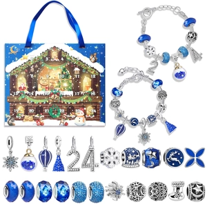 Macro view of blue Christmas advent calendar set with 24 DIY charms and silver bracelets