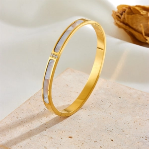 Rose gold titanium steel bangle with shell inlay and three zircons on stone stand