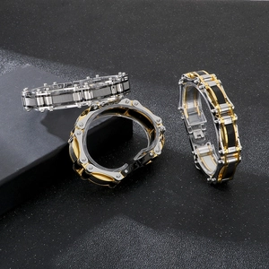Detailed view of industrial mesh link bracelets in steel and gold finish for men