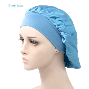 Detail of blue satin hair bonnet with wide elastic band on a model mannequin head