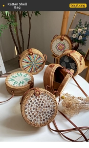 Macro shot of handcrafted shell mosaic patterns on natural rattan crossbody bags