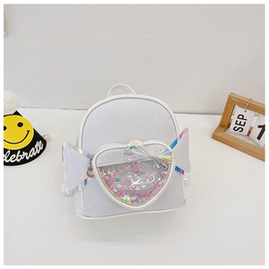 Glittery silver children backpack with heart sequin pocket and colorful bow detail