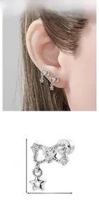 Detail of silver bow heart stud earring with star pendant and precise size measurements