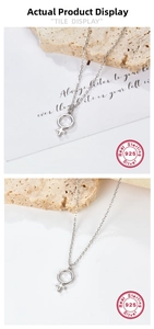 Macro shot of 925 sterling silver Venus symbol pendant on a fine link chain detail