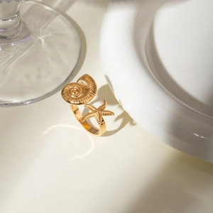 18k gold plated stainless steel open ring with starfish and conch in a 45-degree view