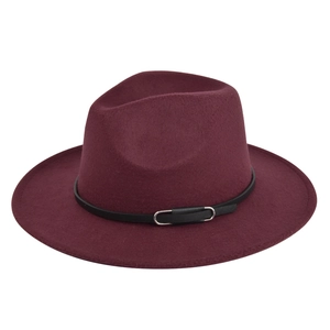 Detail view of burgundy wool felt jazz hat with black band and metal buckle ornament