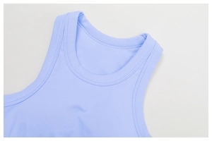 Detail shot of the ribbed knit neckline and reinforced stitching on the blue yoga vest