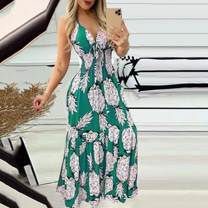 Detail shot of a green and white pineapple print long dress with deep V-neck and tie front