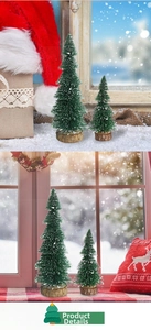 Close-up of mini Christmas trees with white snow tips and natural wooden bases