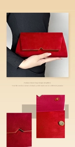 Detail of red velvet evening clutch featuring gold V-shaped metal trim and magnetic snap closure