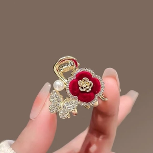 Flocked red rose hair claw clip with golden butterfly and pearl on a metal base