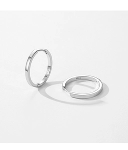 Close-up of S925 sterling silver hoop earrings showing the hallmark and smooth finish