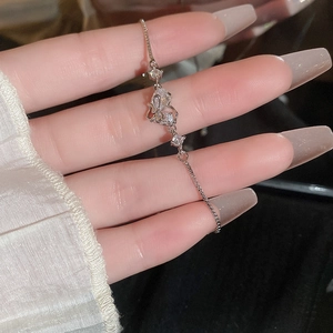 Detail of silver heart bracelet with sparkling zircon stones and adjustable slider clasp