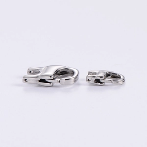 Close-up of polished stainless steel lobster clasps for necklaces in two different sizes