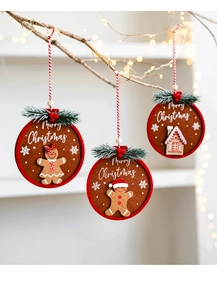 Felt gingerbread ornaments hanging on branches with festive lights for Christmas decor