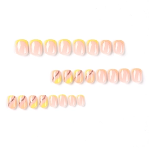 Short square yellow French line press-on nails with glitter spiral accents and 24 pieces