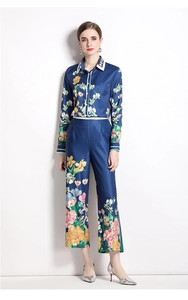 Full view of women's long sleeve navy blue floral print shirt and wide leg trousers set