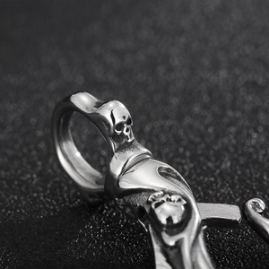 Macro shot of stainless steel skull pendant with intricate metal carving details